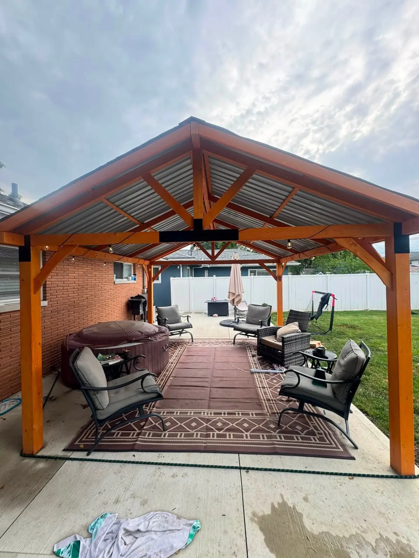 New gazebo build with seating and hot tub