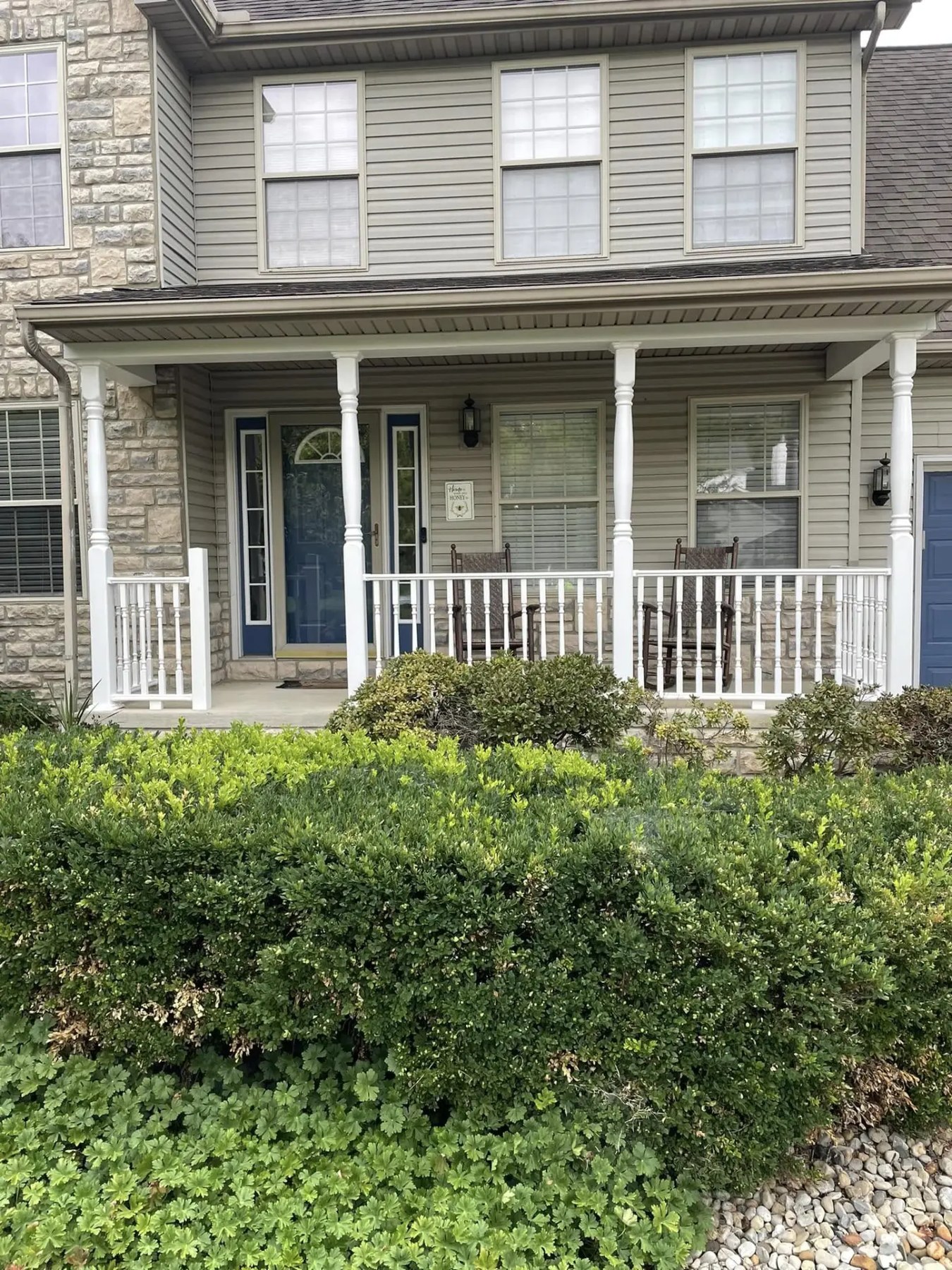 Front porch and exterior of a stone and siding home